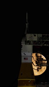 Full Moon Rising Over Full Artemis II Stack at Launch Pad 39B vertical